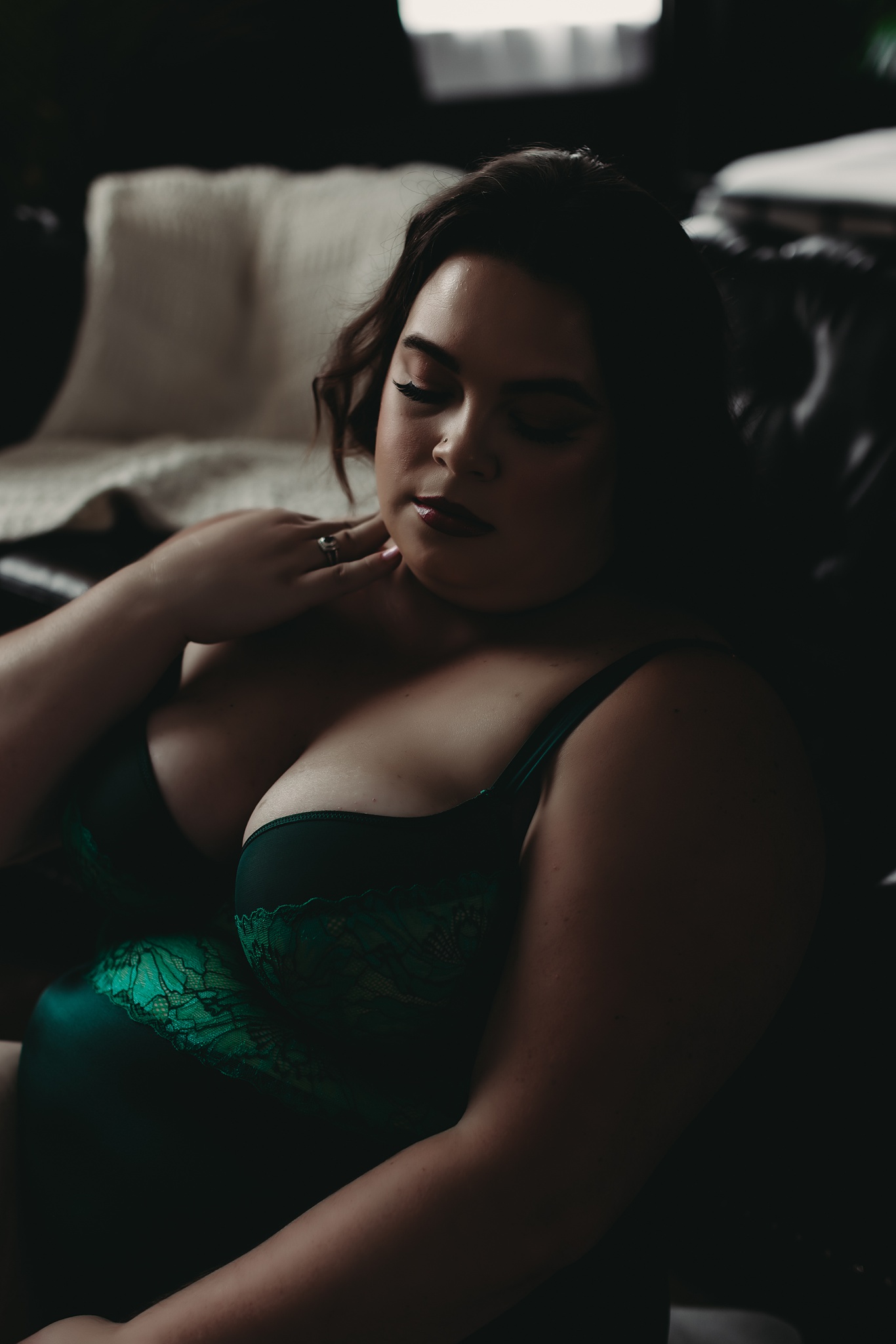 woman sitting on the floor wearing green lingerie