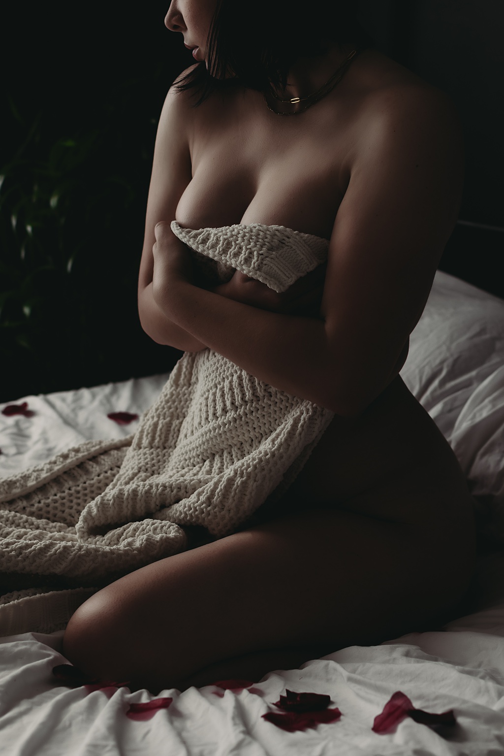 close up boudoir photo of woman wrapped in a blanket